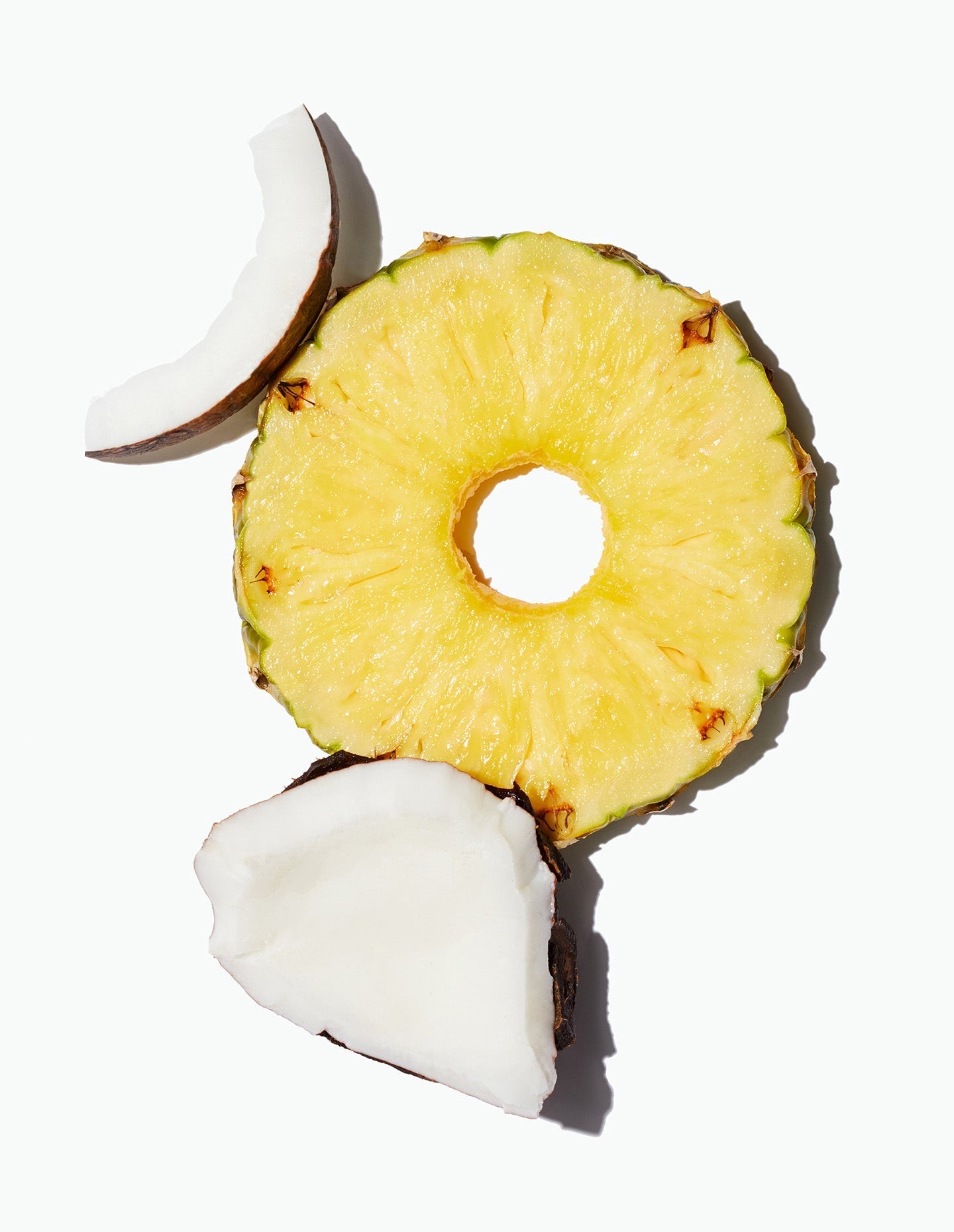 A pineapple ring with pieces of coconut