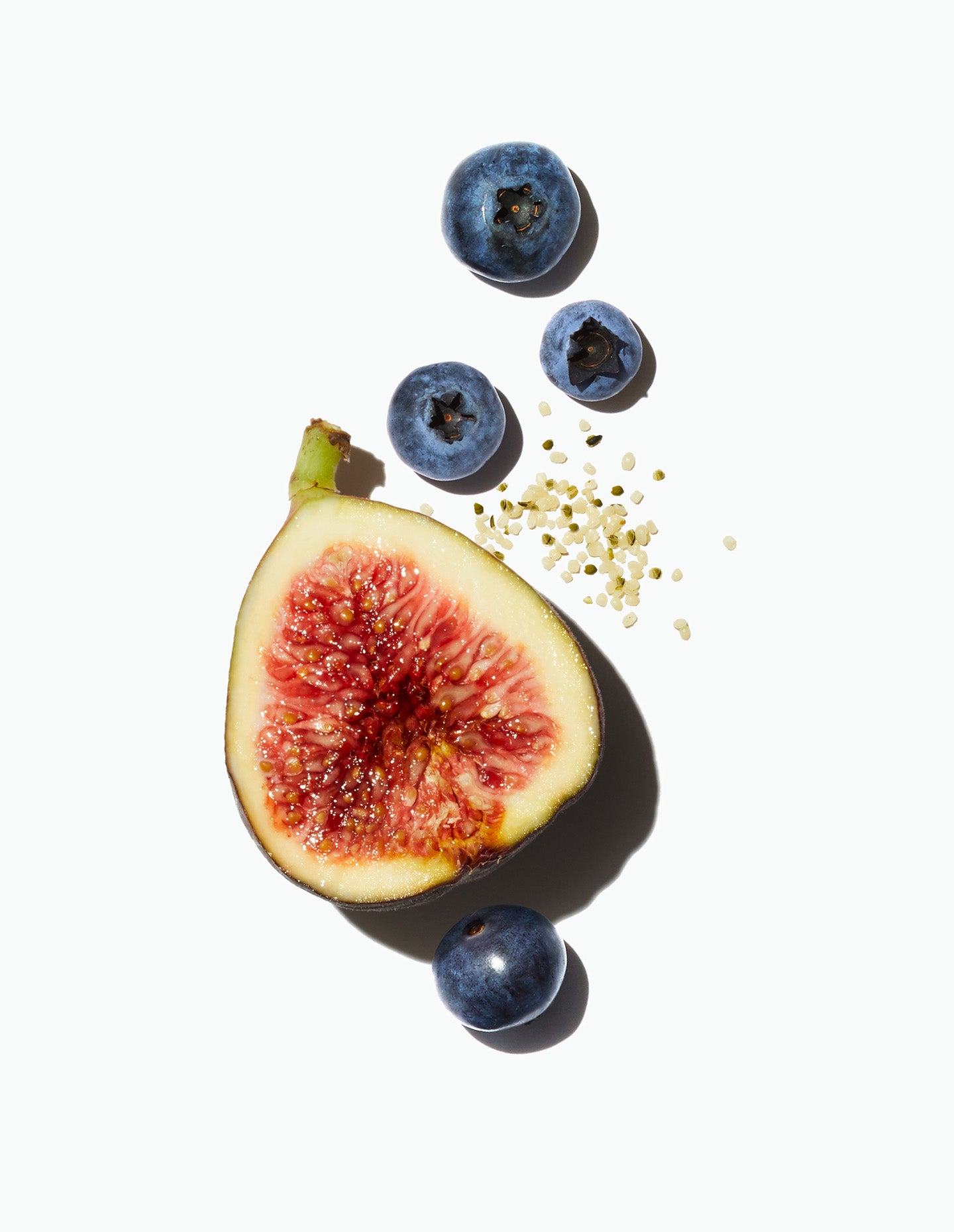 A fig with blueberries and hemp seeds