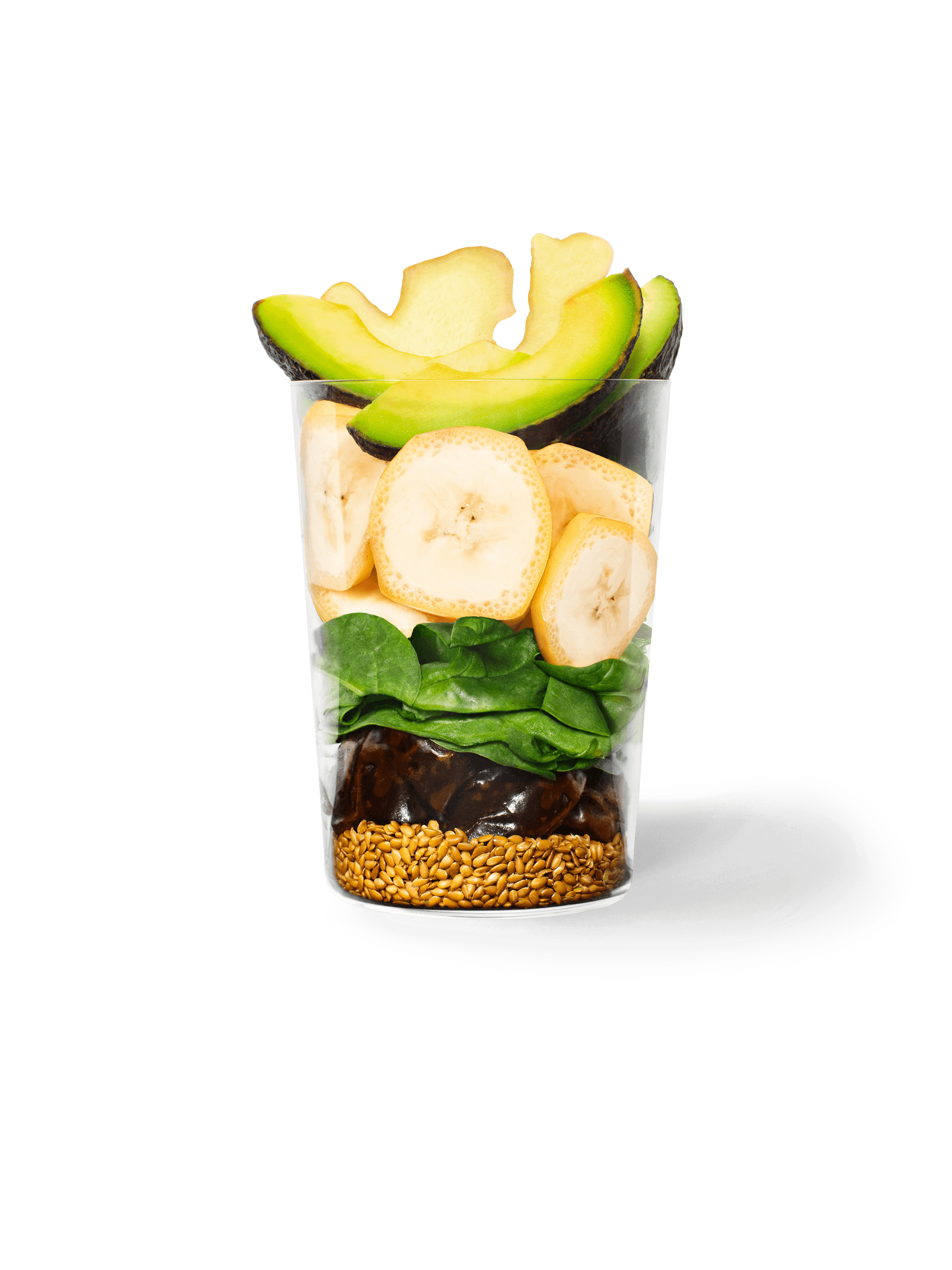 Clear cup filled with the ingredients included in our Ginger + Greens Smoothie