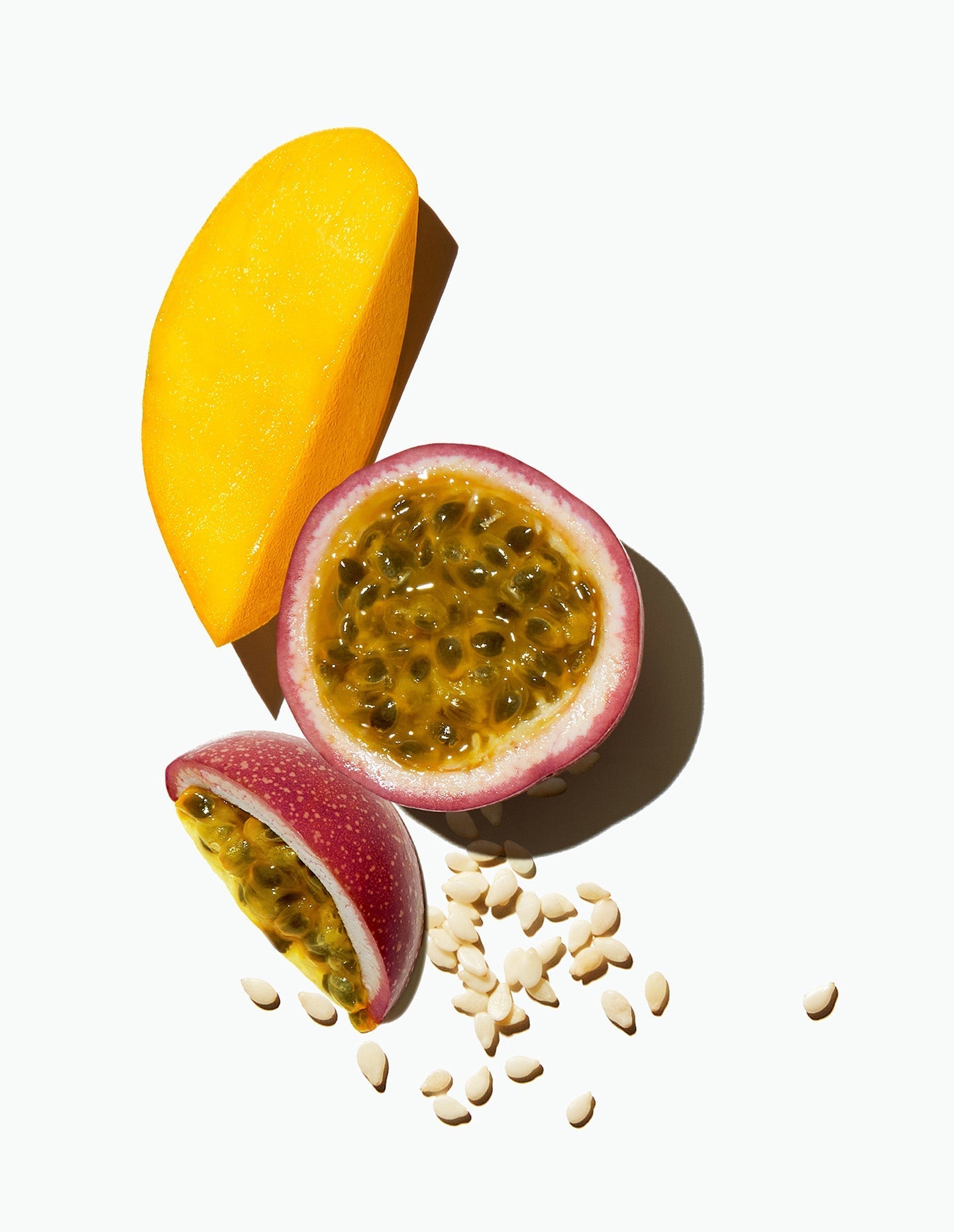 A mango slice, a split passion fruit, and hemp seeds