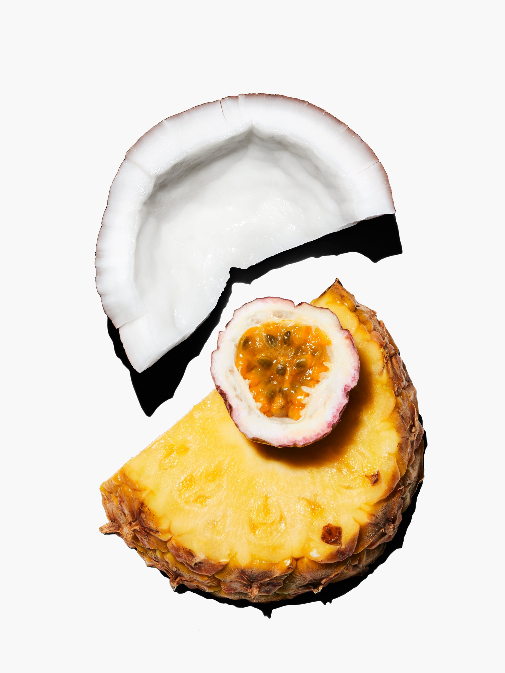 Slices of coconut, passion fruit, and pineapple.