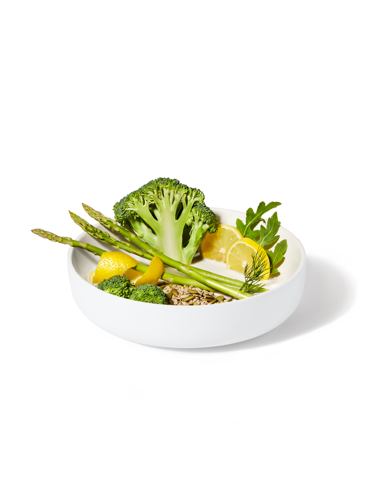 A bowl filled with ingredients included in a Broccoli Rice + Dill Pilaf Harvest Bowl