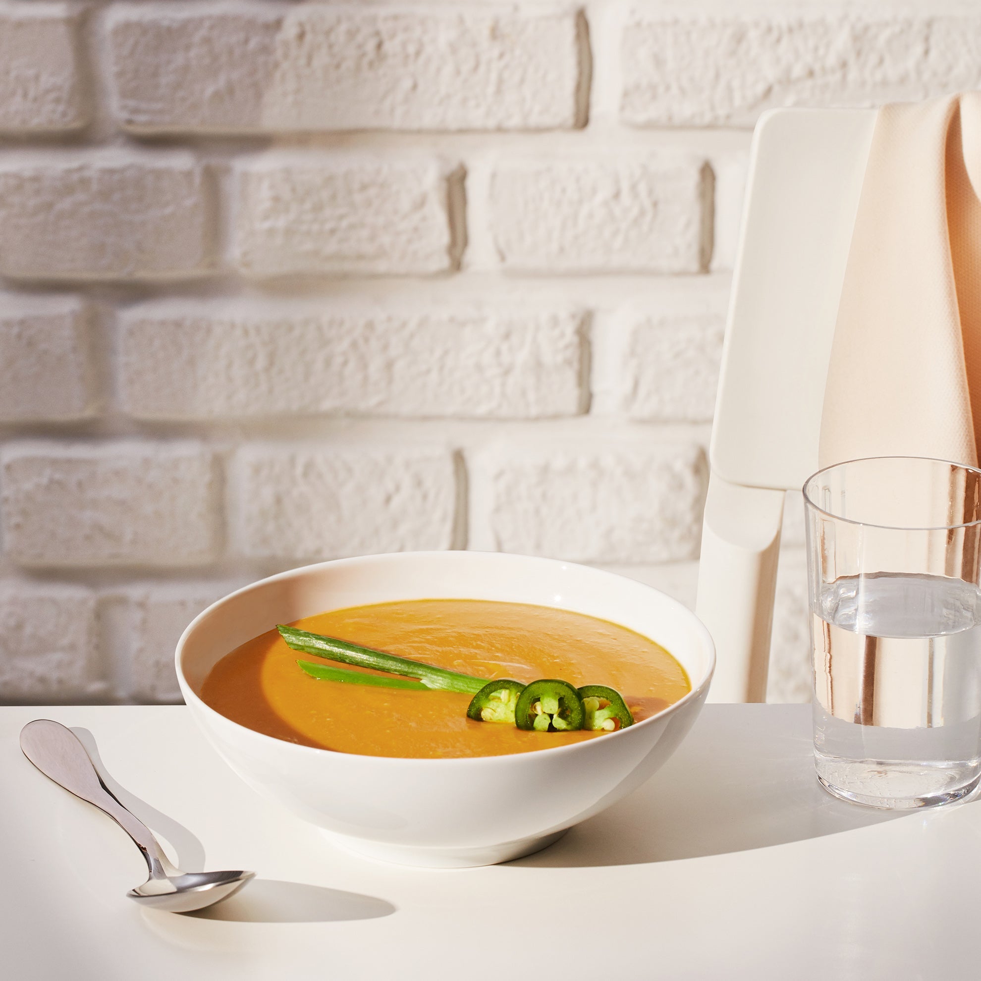 Lifestyle image of Daily Harvest Sweet Potato + Miso Soup prepared in a bowl.