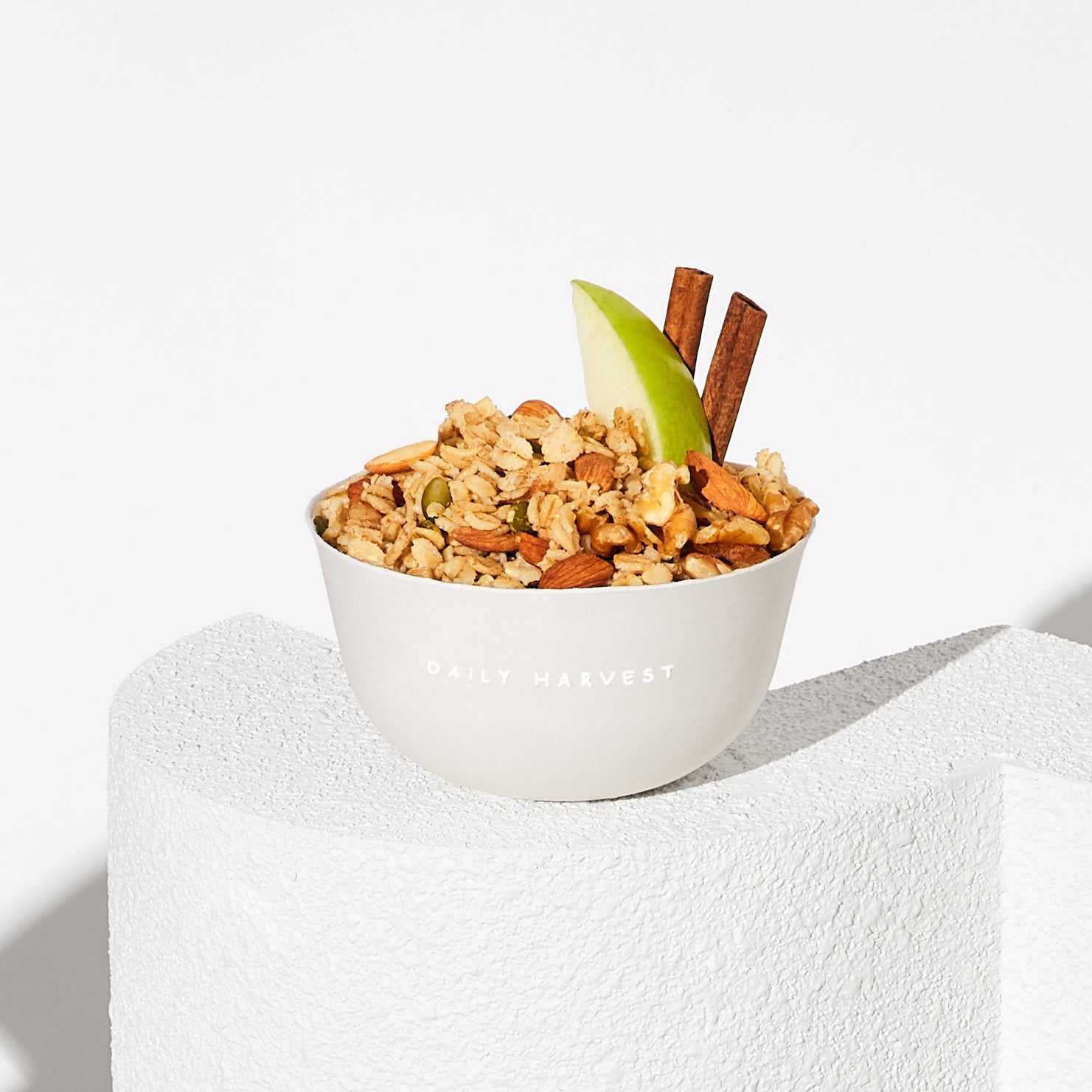 Image of Daily Harvest Apple + Cinnamon Oat Bowl prepared in a bowl with garnish.