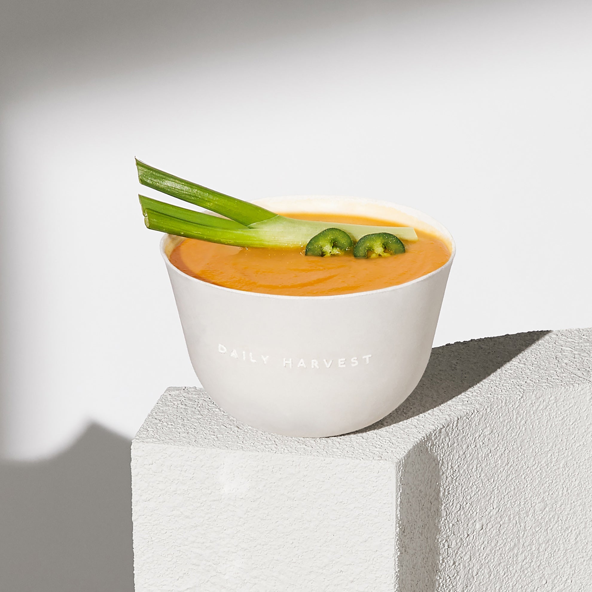 Lifestyle image of Daily Harvest Sweet Potato + Miso Soup prepared in a bowl.
