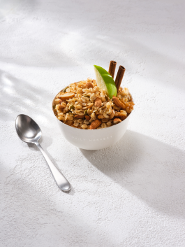 Image of Daily Harvest Apple + Cinnamon Oat Bowl prepared in a bowl with garnish.