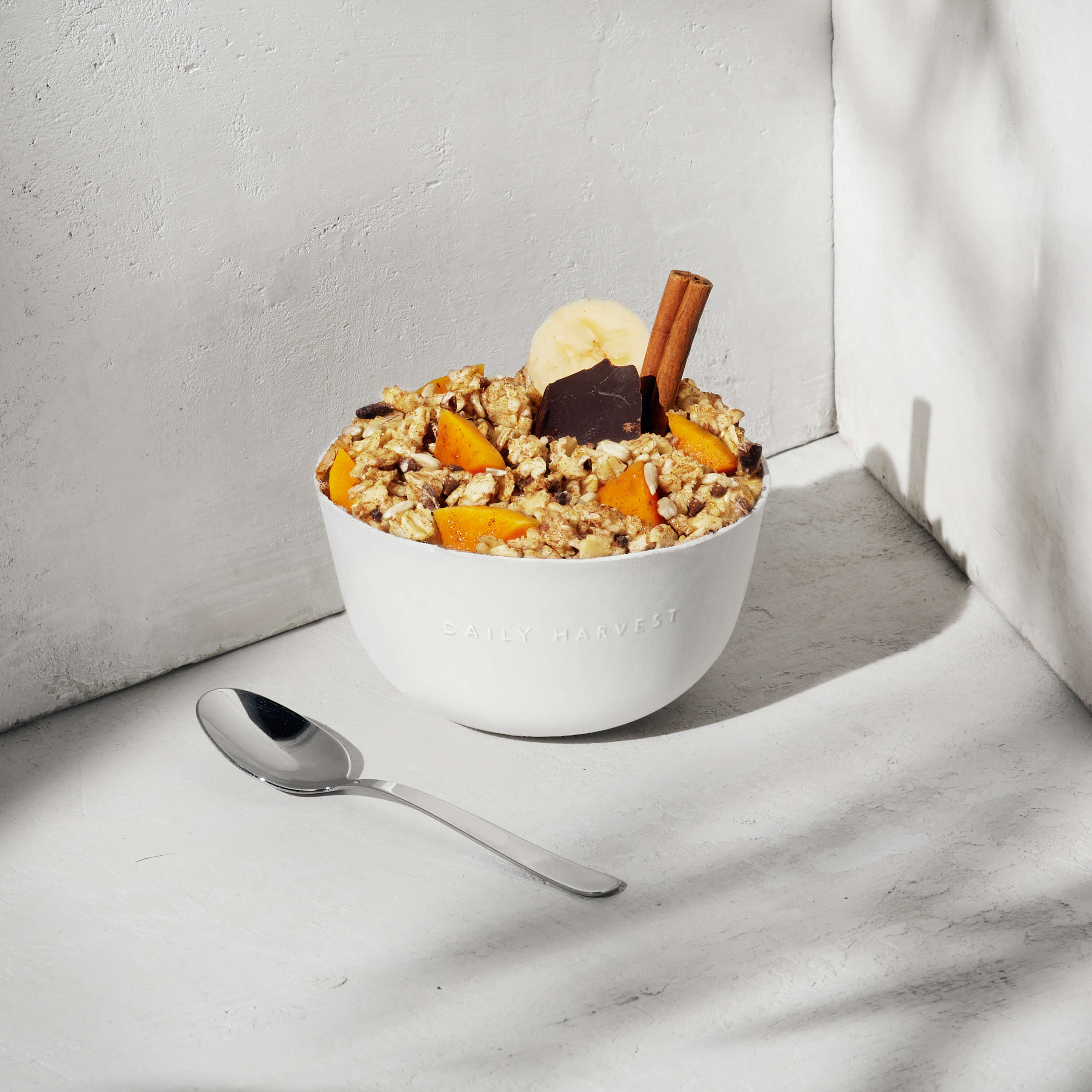 Cinnamon + Banana Oat Bowl with a spoon