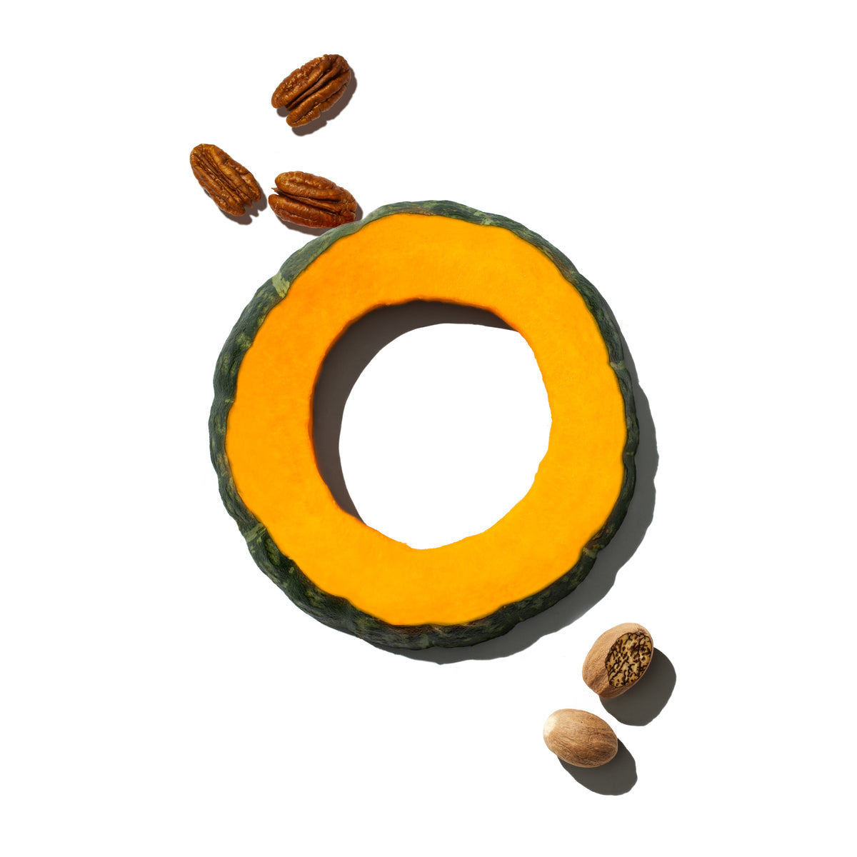 a slice of kabocha squash with some nutmeg and pecans