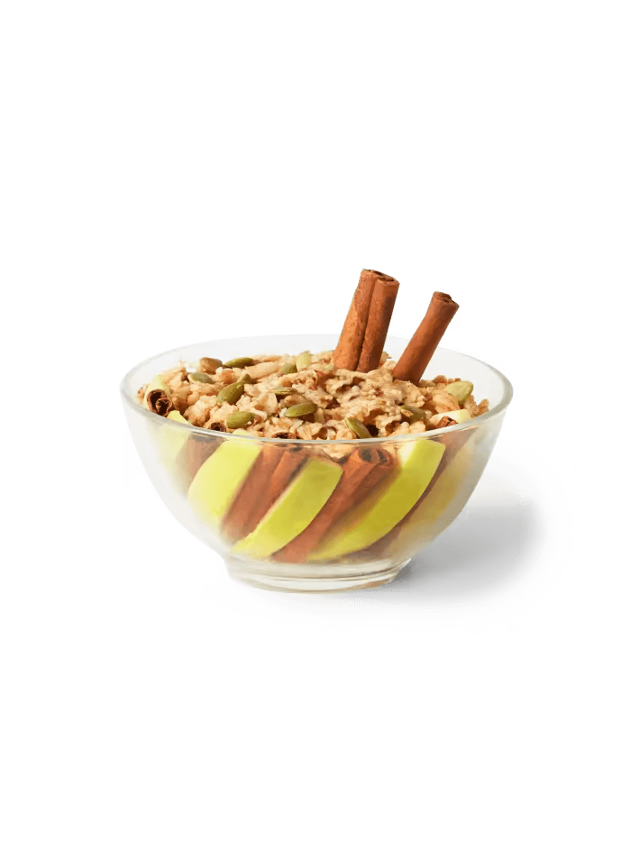 Image of Daily Harvest Apple + Cinnamon Oat Bowl prepared with cinnamon and apple garnish.