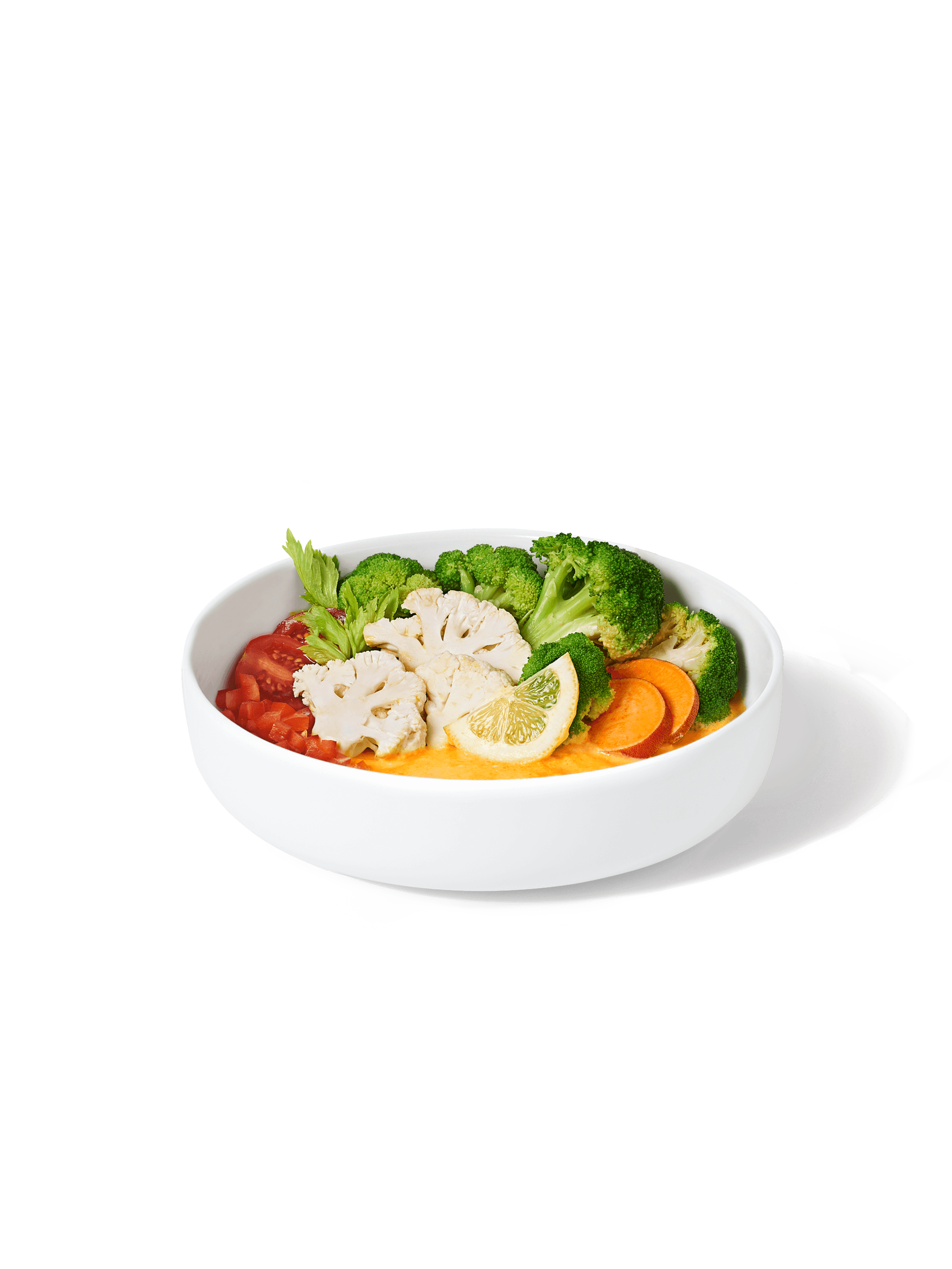 A bowl filled with ingredients included in a Broccoli + Cheeze Harvest Bowl