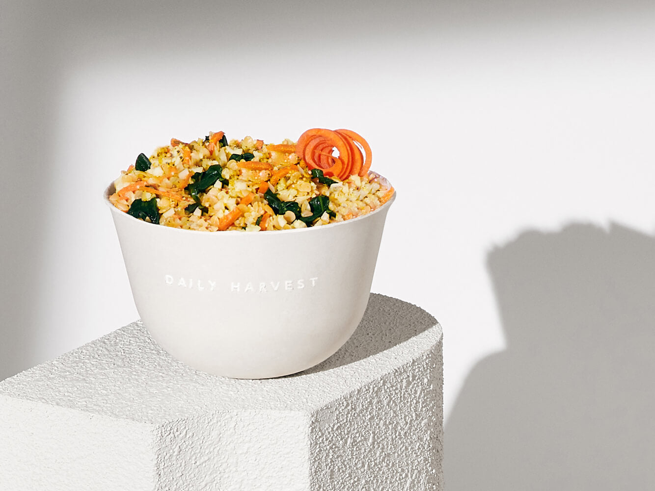 A lifestyle image of Daily Harvest Red Lentil + Cumin Harvest Bowl prepared in a bowl.