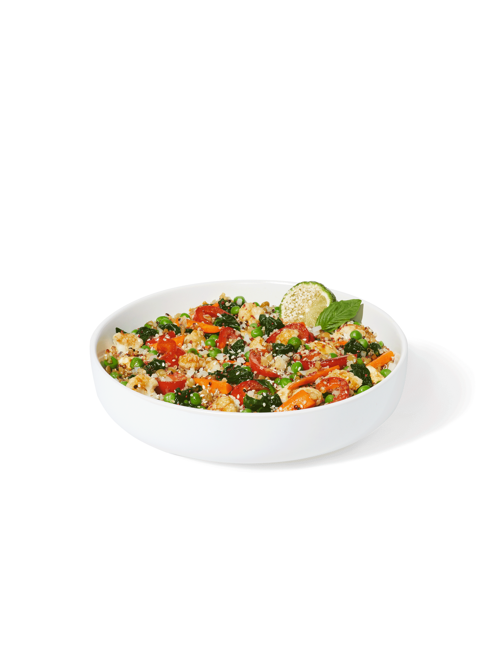 A prepared Quinoa + Makrut Lime Harvest Bake in a large white bowl.