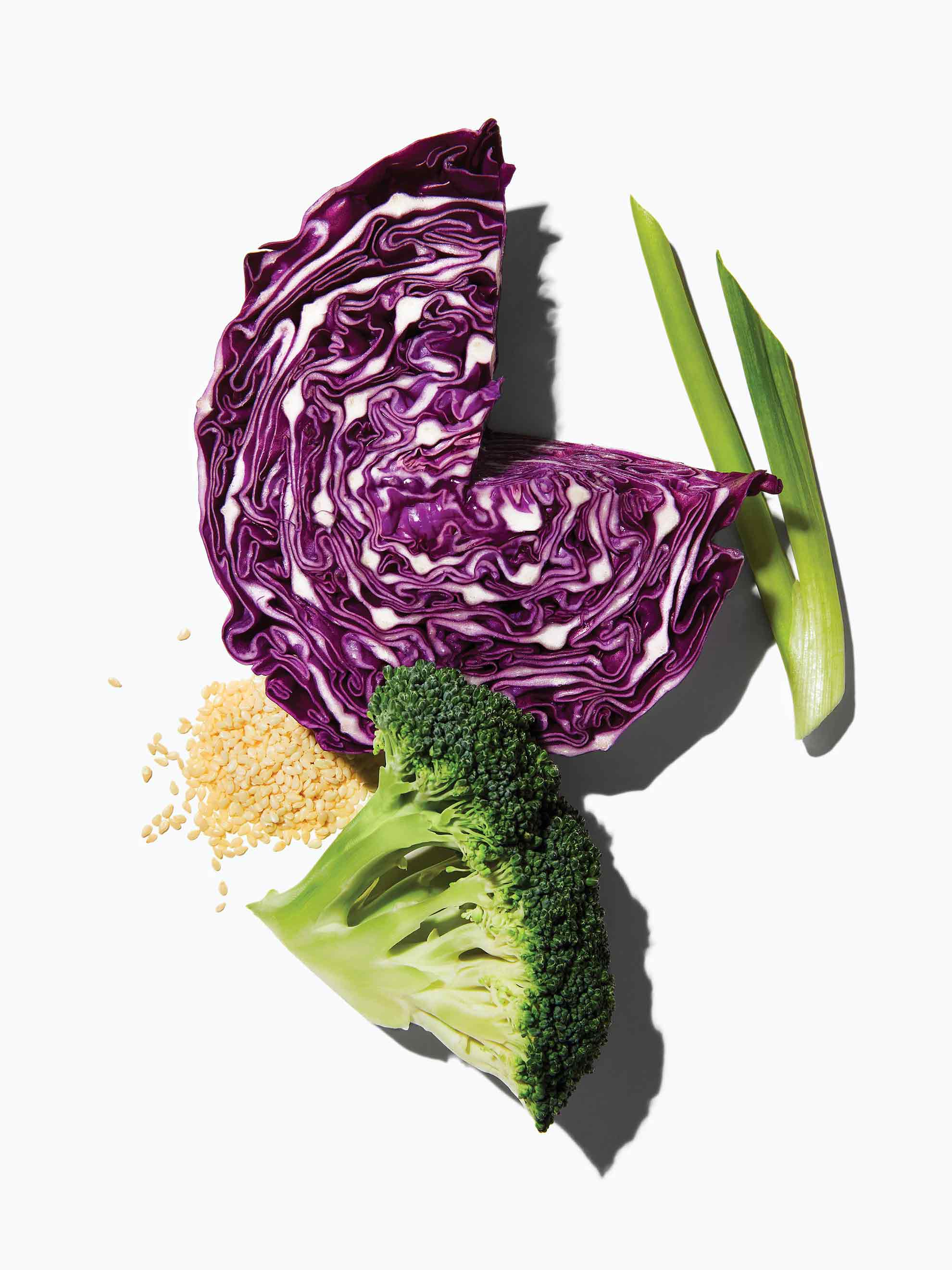 The ingredients included in Daily Harvest's Broccoli + Tamari Sesame Harvest Bowl including green onion, red cabbage, broccoli, and cauliflower rice.