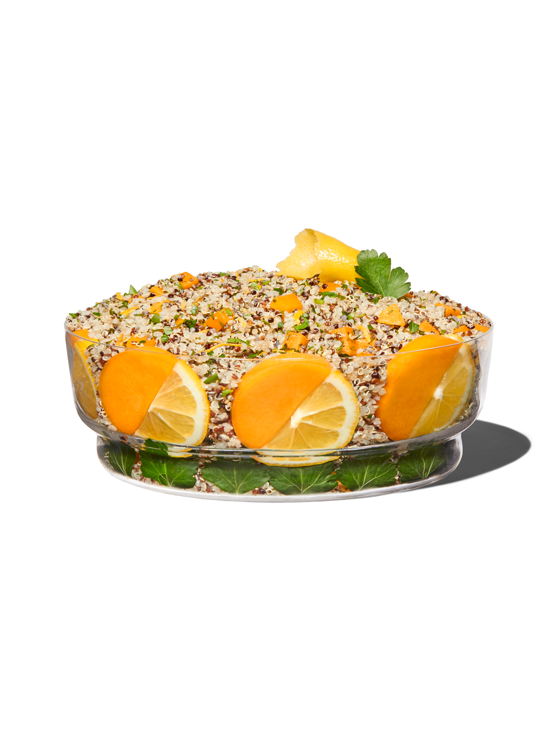 Clear bowl with the ingredients included in our lemon quinoa and butternut squash grains.